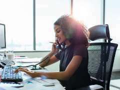 a person working at a desk in an office